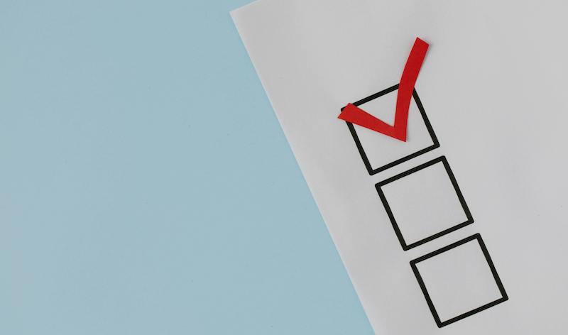 checklist with red checkmark at the top