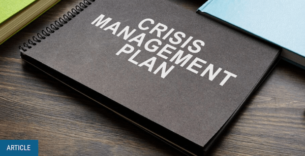 Photo of a book titled 'Crisis Management Plan'